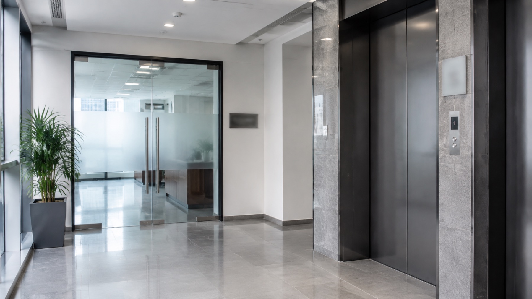 The lift lobby and glass entrance of a professional office floor